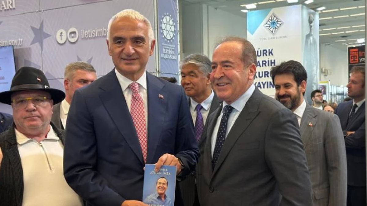 &Ouml;DEMİŞ, BAKAN ERSOY'A KİTAP HEDİYE ETTİ 